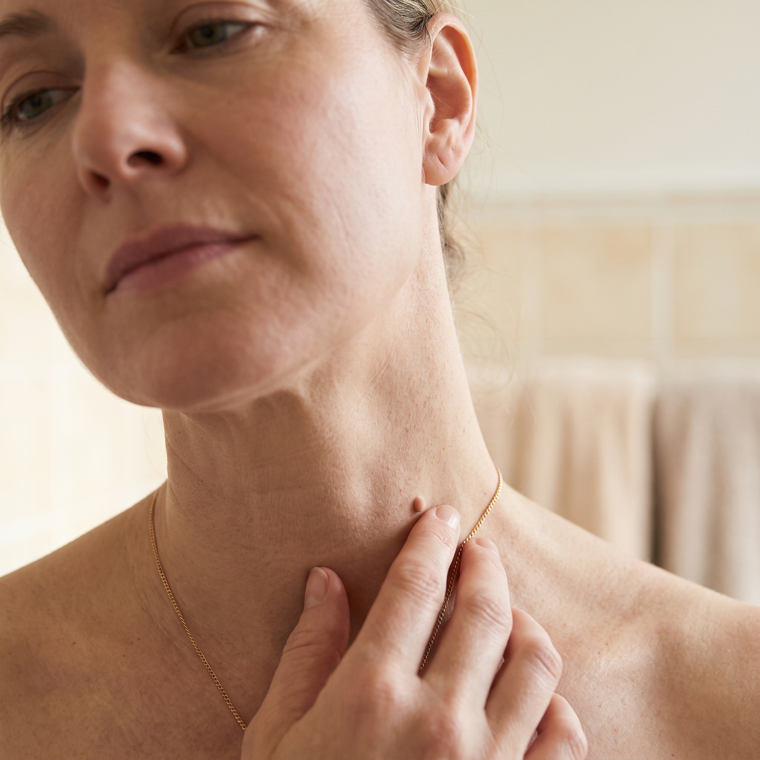 A small skin tag on the neck catching on a shirt collar
